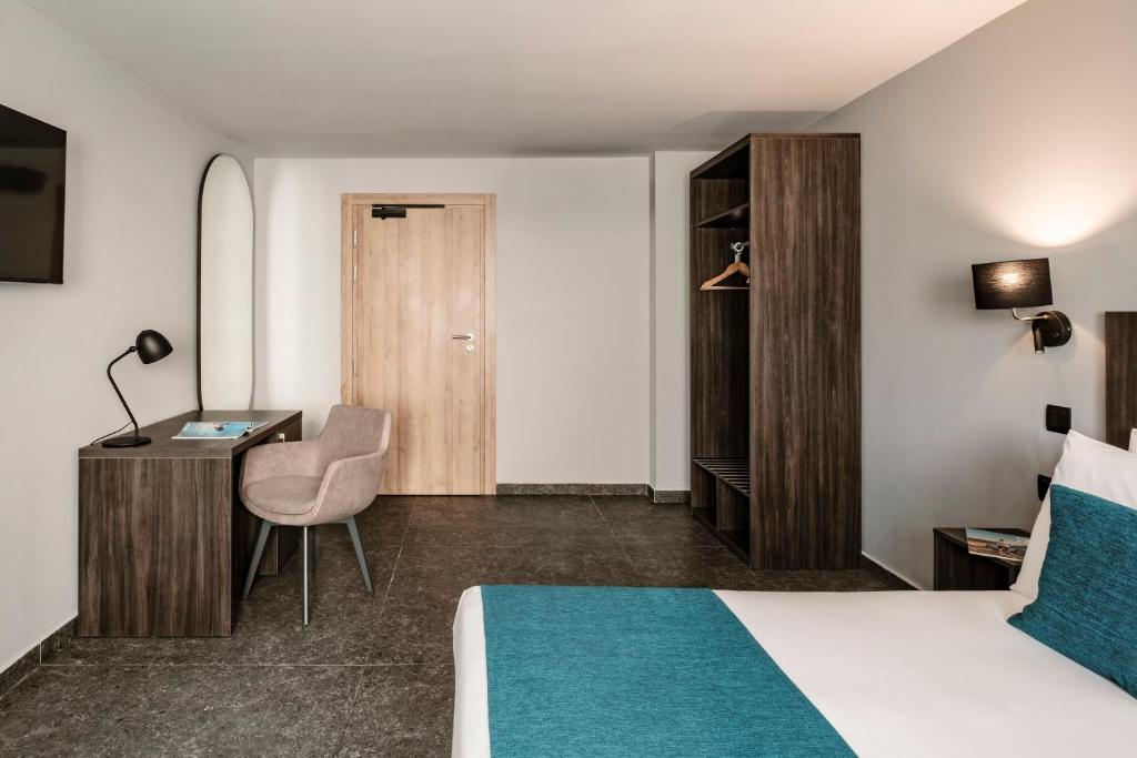 Postel nebo postele na pokoji v ubytování Spinola Hotel