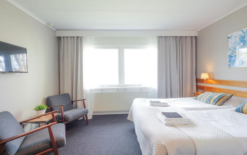 Postel nebo postele na pokoji v ubytování Hotell Veckefjärden