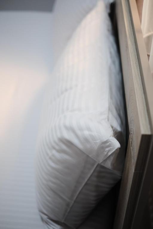 Postel nebo postele na pokoji v ubytování Loft Family Hotel