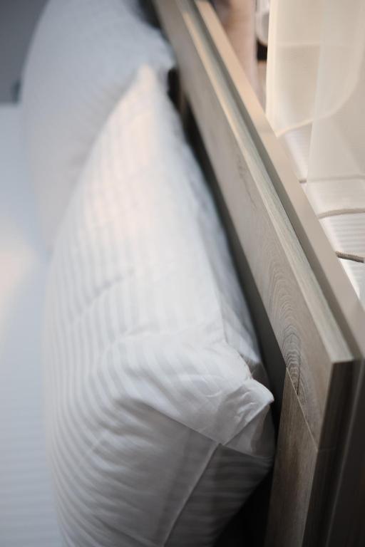 Postel nebo postele na pokoji v ubytování Loft Family Hotel