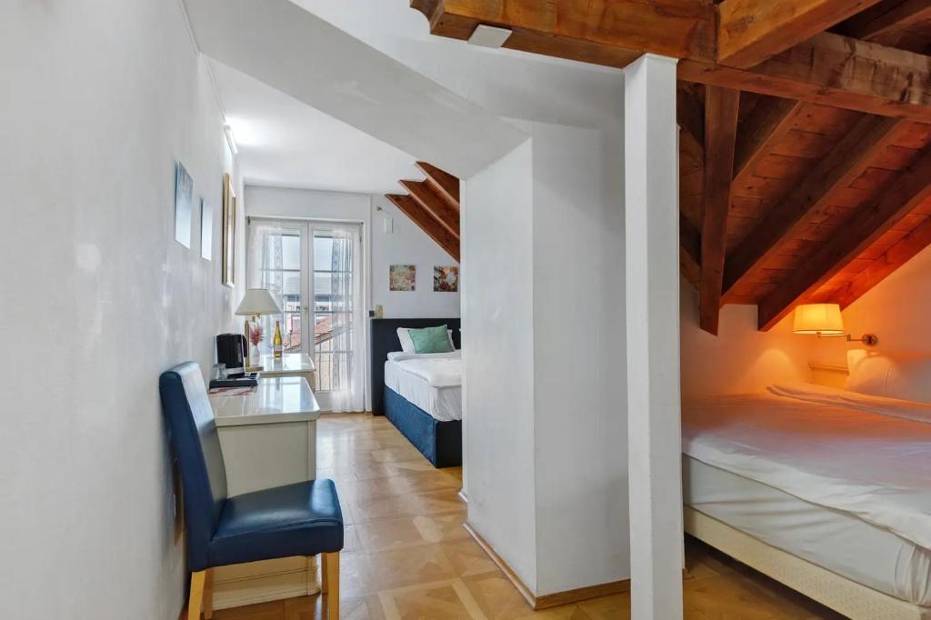 Postel nebo postele na pokoji v ubytování SEE-Hotel Seeschau - direkt am Bodenseeufer