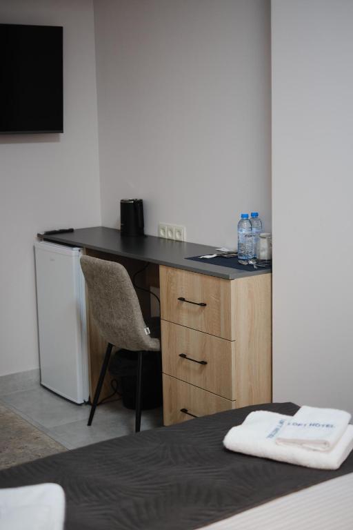 TV a/nebo společenská místnost v ubytování Loft Family Hotel