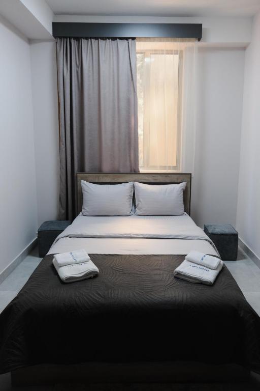 Postel nebo postele na pokoji v ubytování Loft Family Hotel
