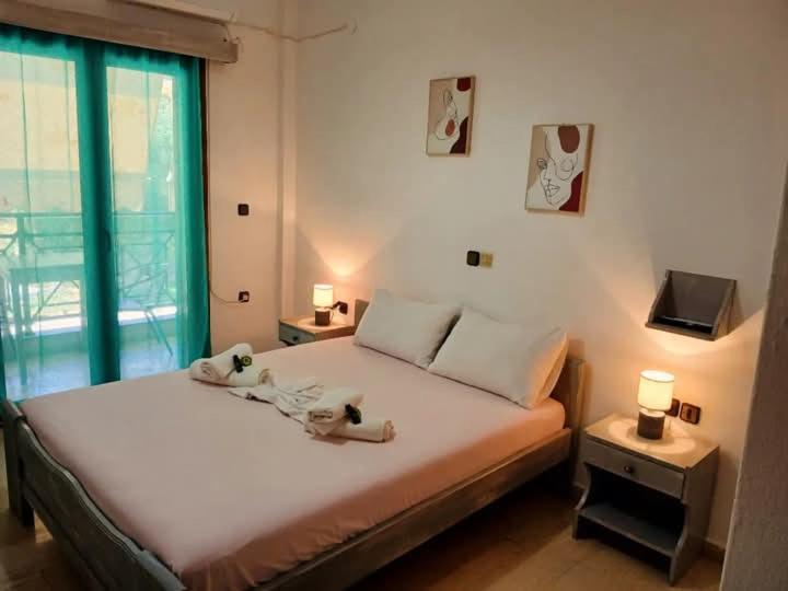 Postel nebo postele na pokoji v ubytování Hotel Akropolis