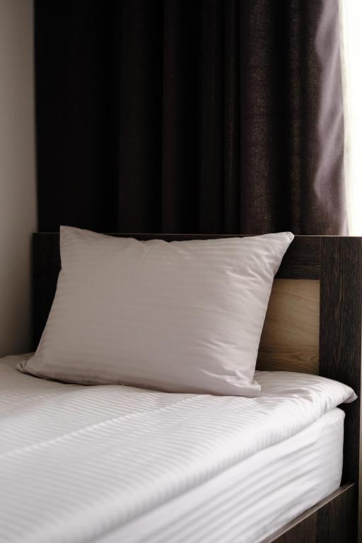Postel nebo postele na pokoji v ubytování Loft Family Hotel