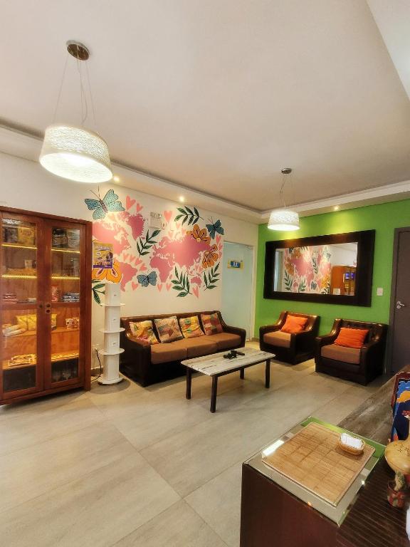 Uma área de estar em Bonabrigo Hostel & Suítes