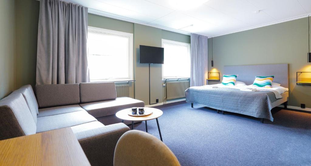 Postel nebo postele na pokoji v ubytování Hotell Veckefjärden