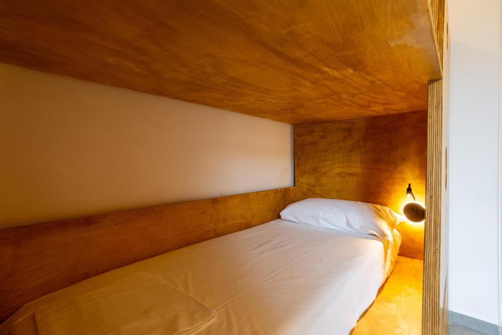 Postel nebo postele na pokoji v ubytování Hotel Paola