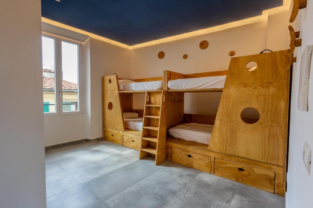 Postel nebo postele na pokoji v ubytování Hotel Paola