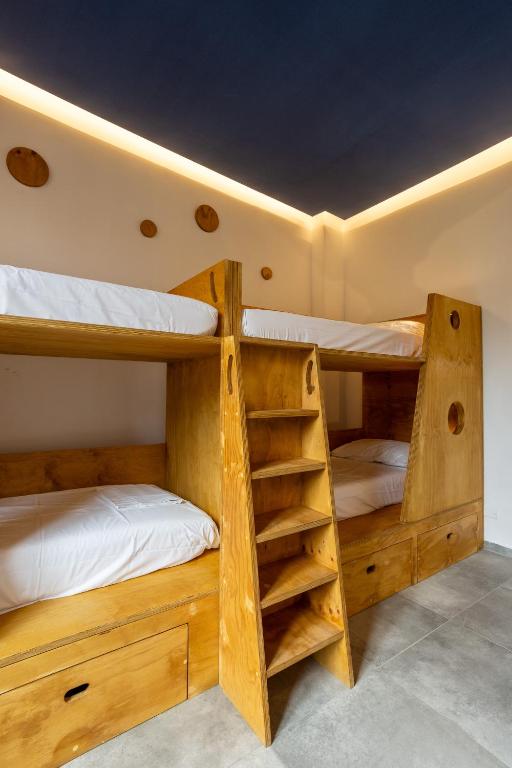 Postel nebo postele na pokoji v ubytování Hotel Paola