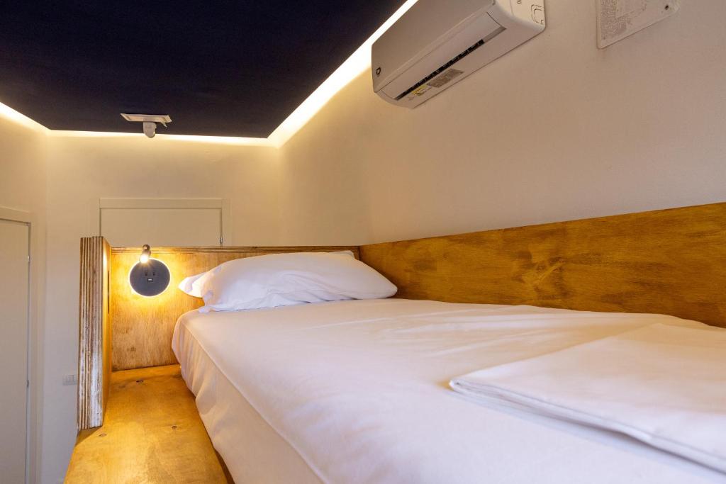 Postel nebo postele na pokoji v ubytování Hotel Paola