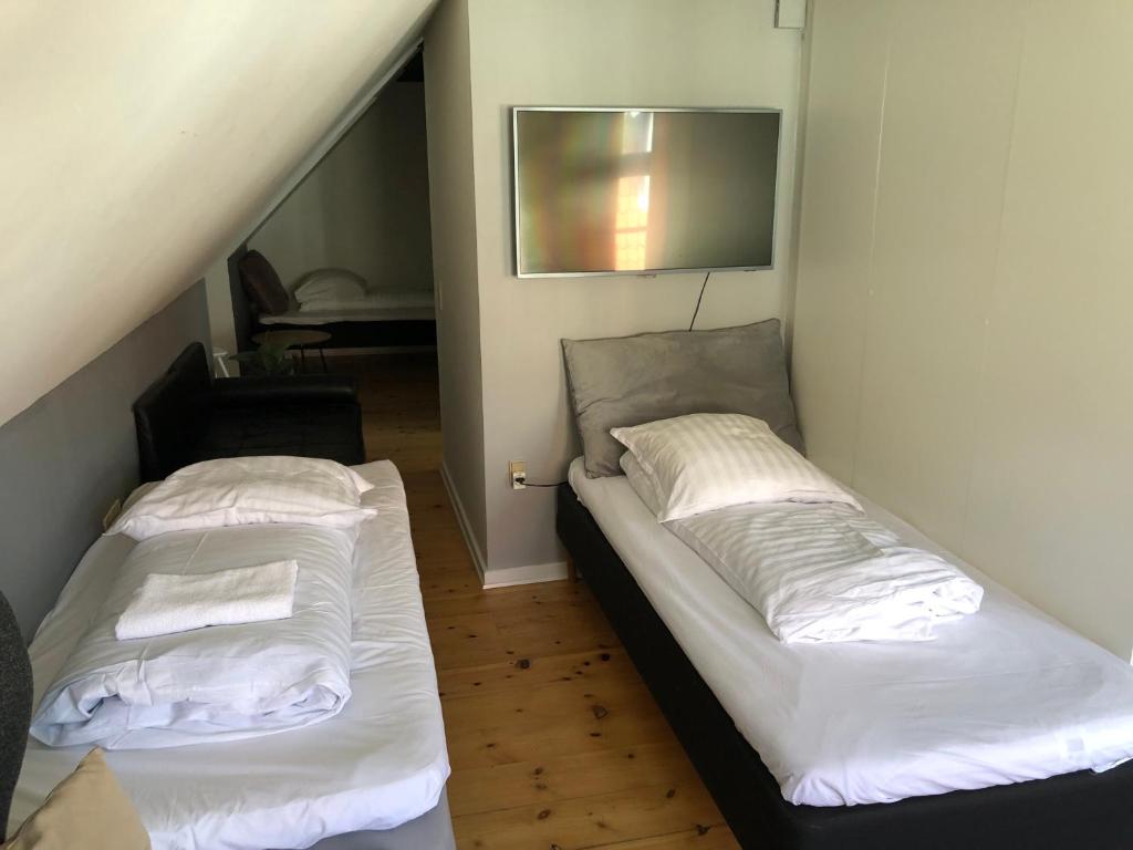 Postel nebo postele na pokoji v ubytování Huset ved springvandet