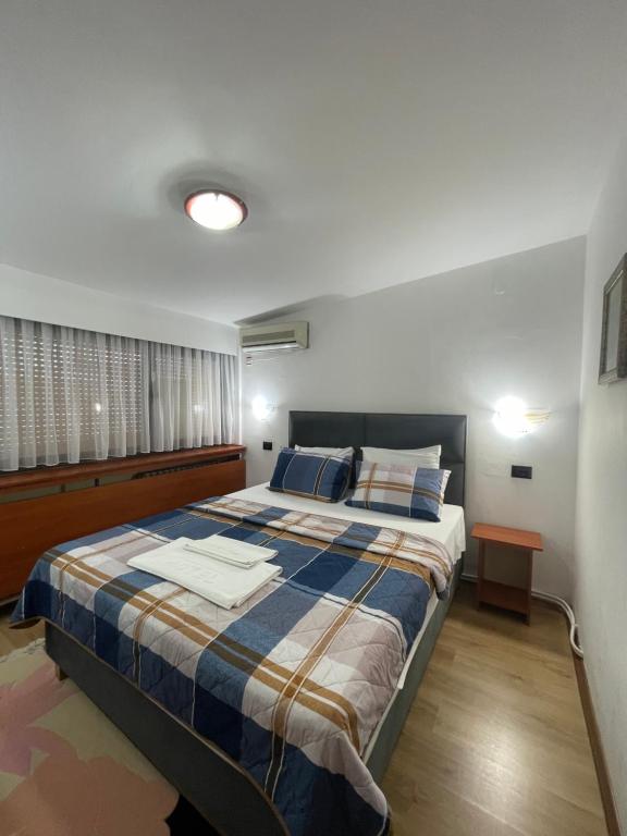 Postel nebo postele na pokoji v ubytování Hotel Square