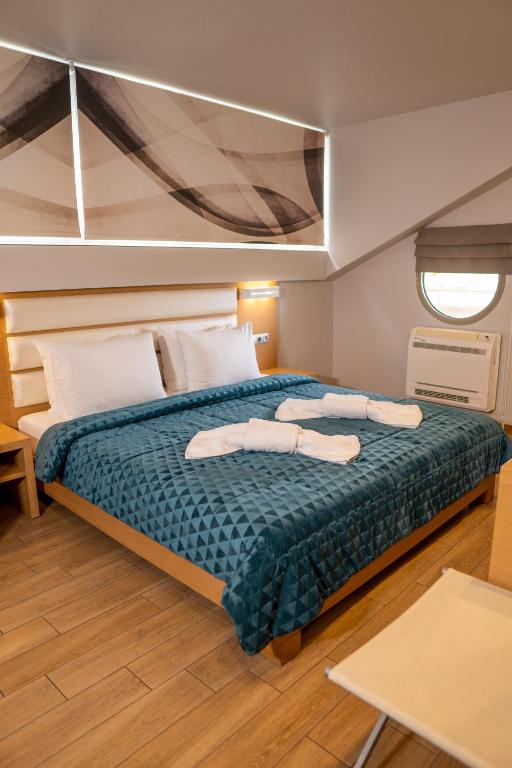 Postel nebo postele na pokoji v ubytování Hotel Epavlis Eleftheriadi