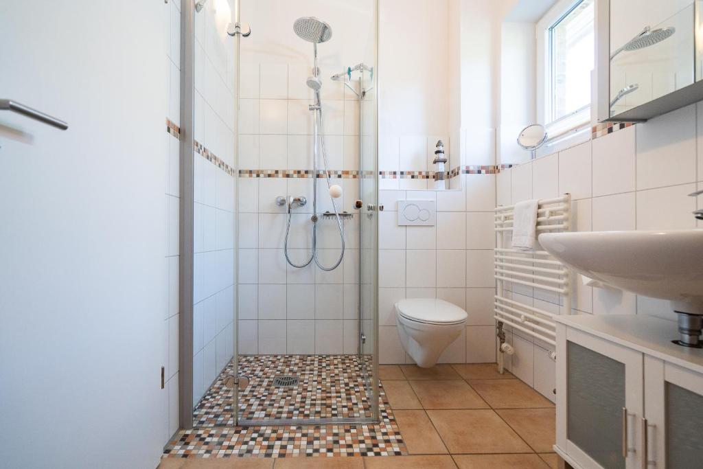 Koupelna v ubytování Feriendorf Südstrand Haus 7