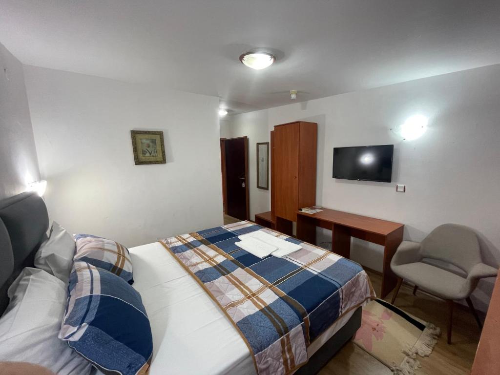 Postel nebo postele na pokoji v ubytování Hotel Square