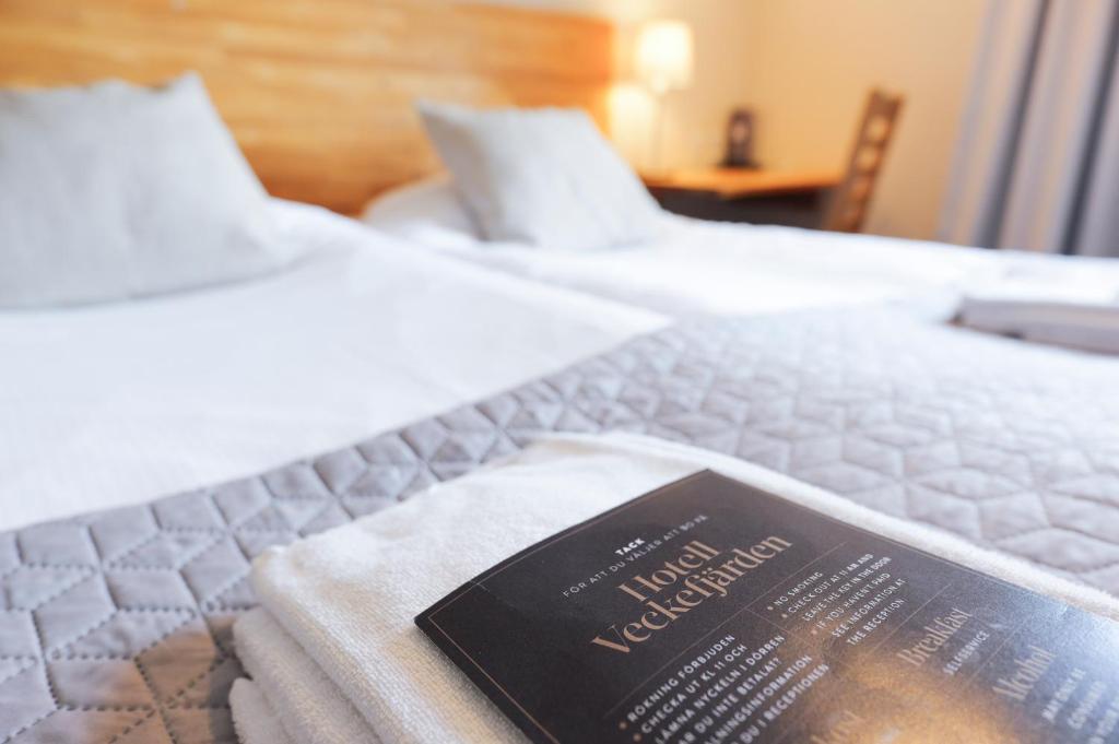 Postel nebo postele na pokoji v ubytování Hotell Veckefjärden