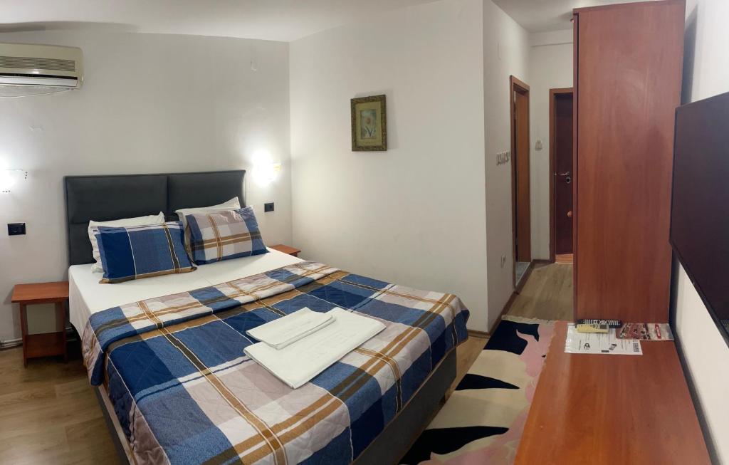 Postel nebo postele na pokoji v ubytování Hotel Square