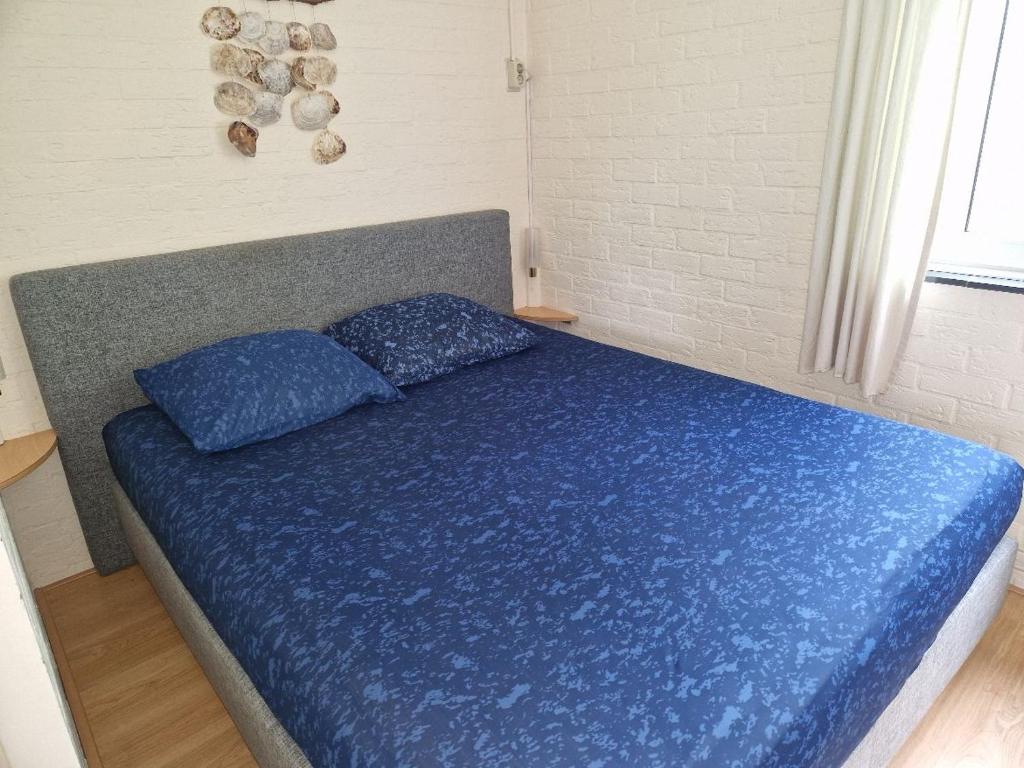 Postel nebo postele na pokoji v ubytování Robbenoort 45