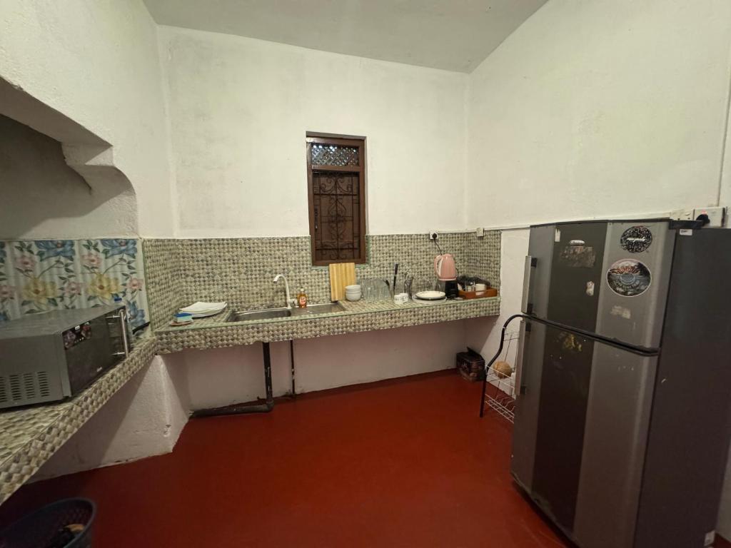 Kuchyň nebo kuchyňský kout v ubytování Moonlight surf hostel