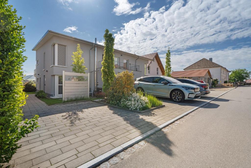 a car parked in front of a house at Wohlfühlhaus in Freiamt