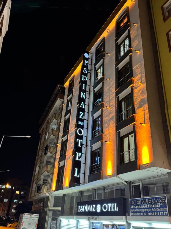 a building with a sign on the side of it at Espinaz Apart Otel in Bostaniçi