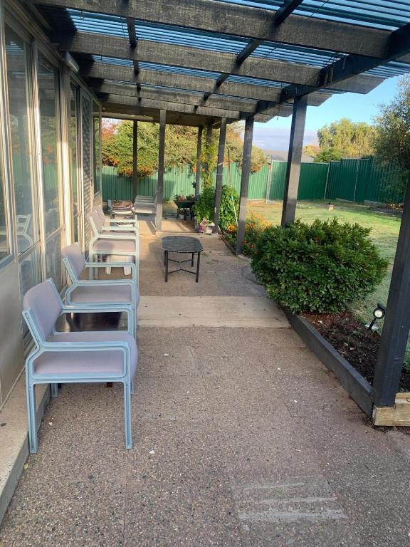 a row of benches sitting on a patio at 76 Companion Crescent in Higgins
