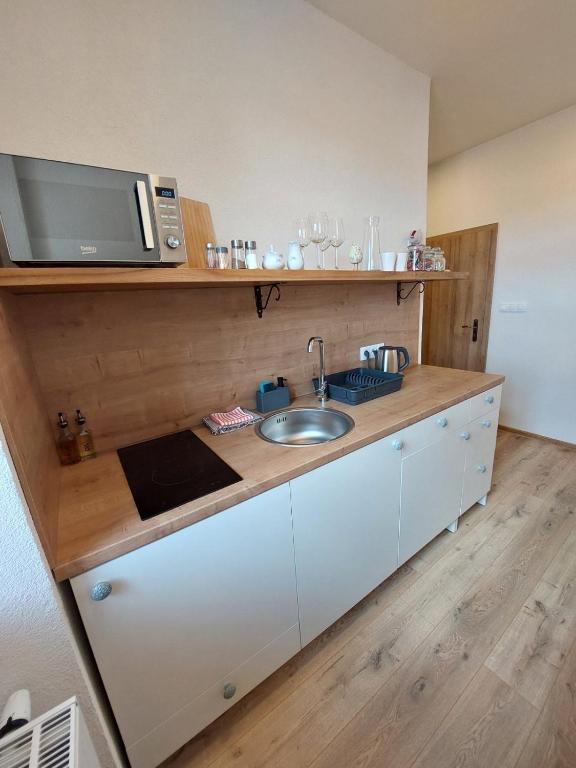 Kuchyň nebo kuchyňský kout v ubytování Alipoint Apartments