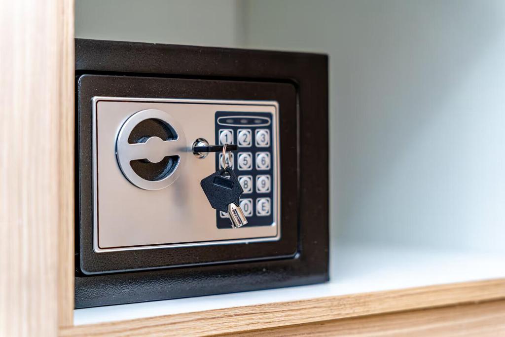 a microwave with a remote control on a shelf at Donna's luxury home in Kassiopi 300m from the sea in Kassiopi
