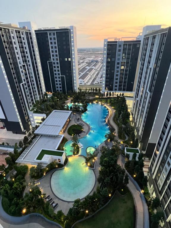 an aerial view of a resort with tall buildings at Gamuda Cove Homestay in Banting