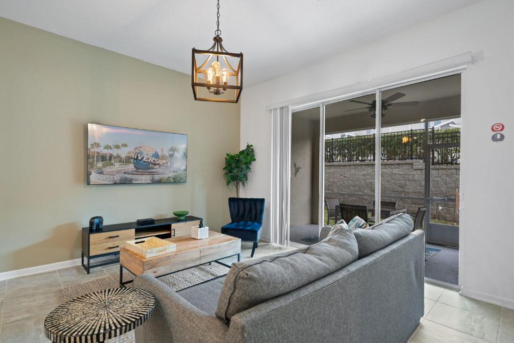 a living room with a couch and a table at CONDO 2bed2bath next to Disney w Free Water Park in Kissimmee