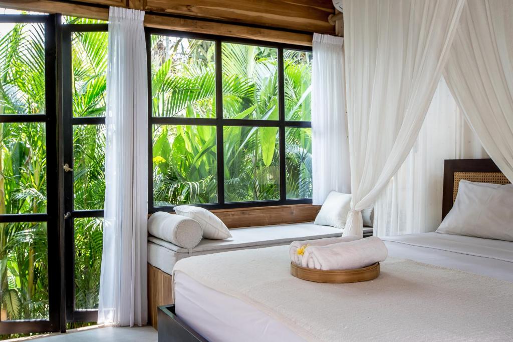 فضای داخلی Nido Boutique Cottage Canggu در بالی - تصویر ۳