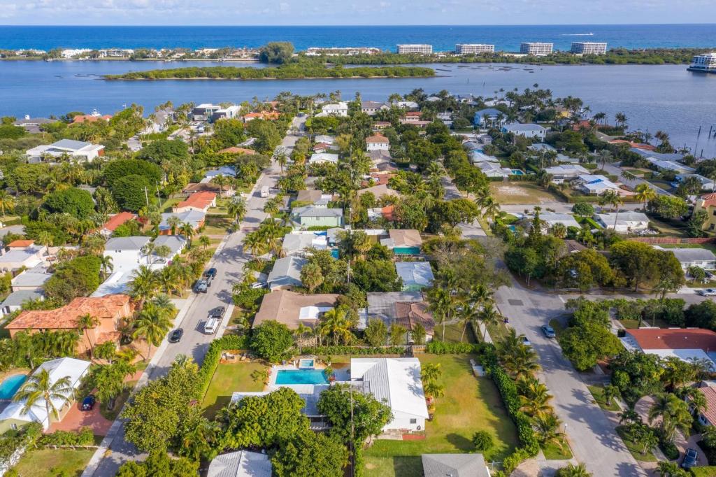 an aerial view of a community of houses next to the water at Casa Relaxation in West Palm Beach