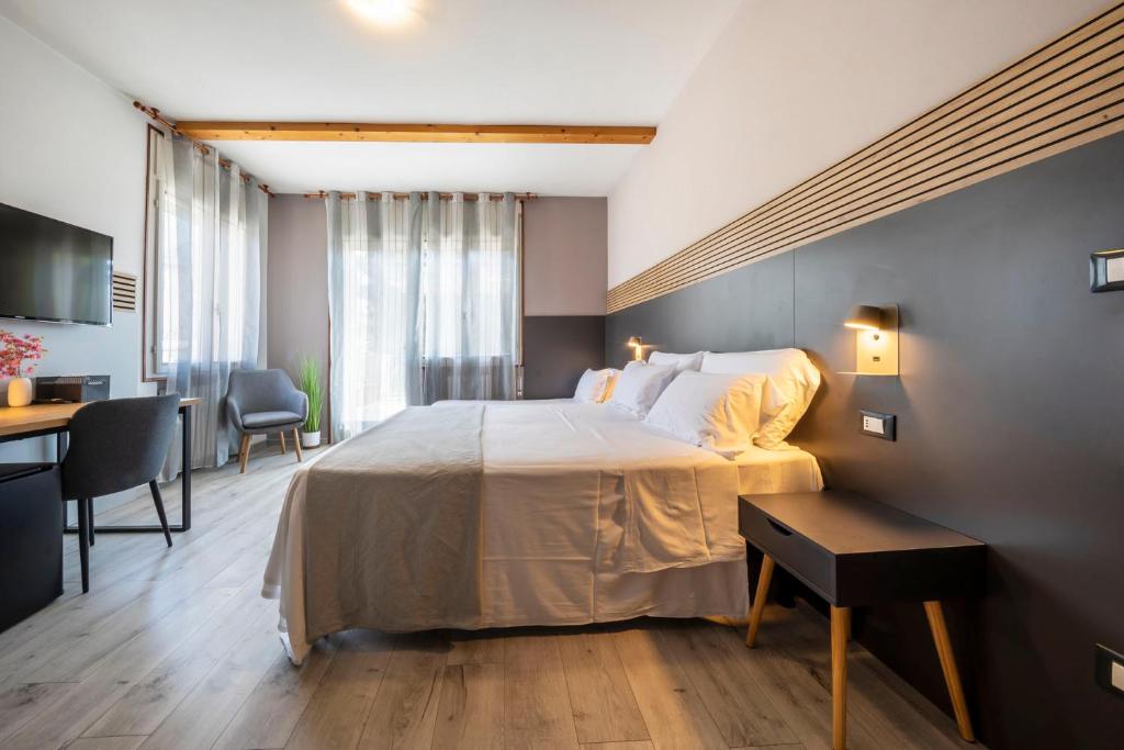 Postel nebo postele na pokoji v ubytování Bed & Bike Feltre