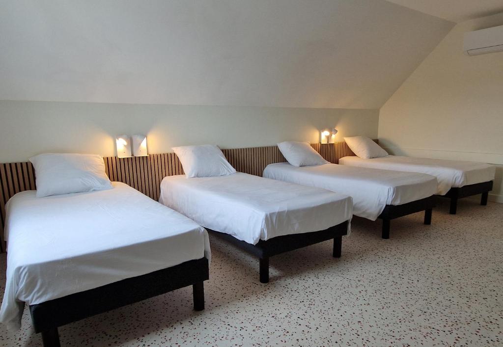 Postel nebo postele na pokoji v ubytování Hotel Eisenhower