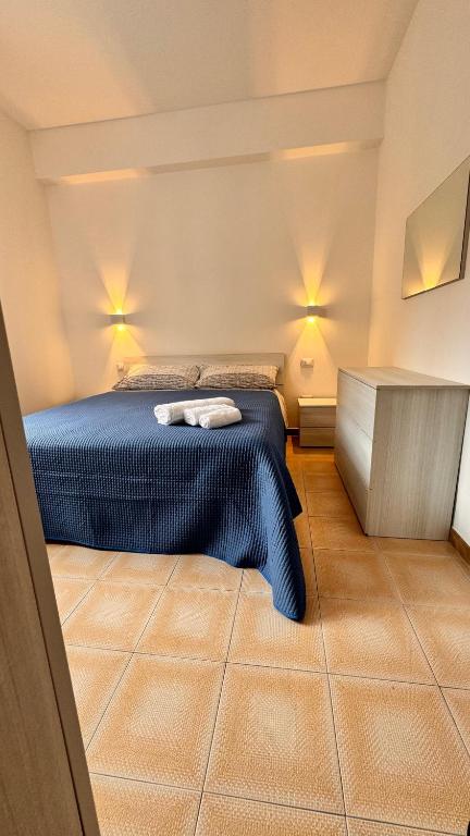 a bedroom with a bed with two towels on it at Casa vacanza Stella in Torre Forte