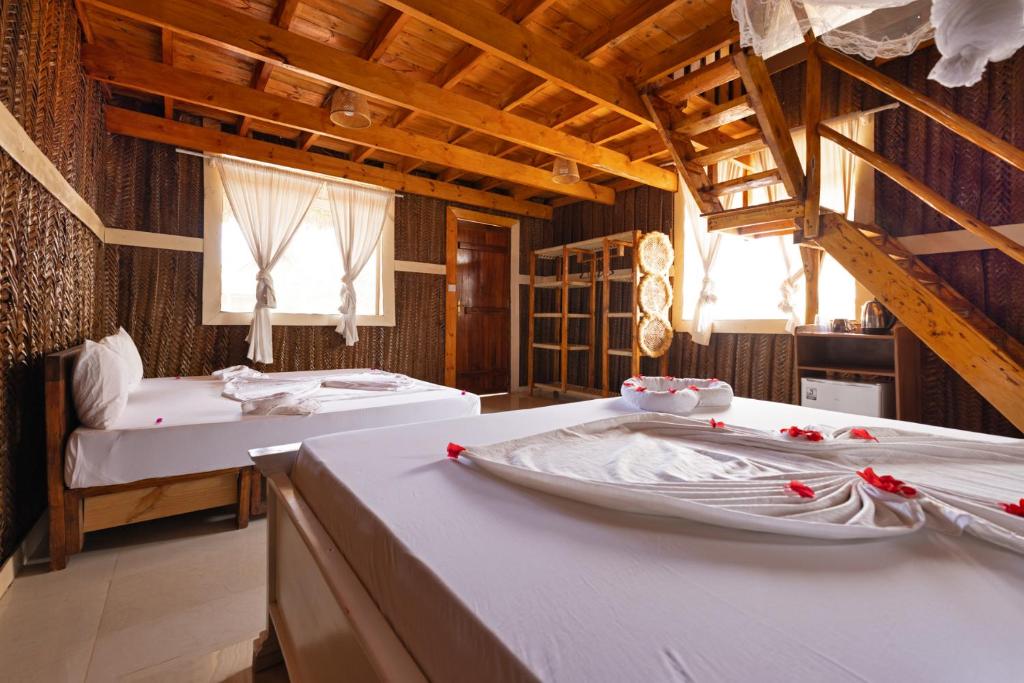 Postel nebo postele na pokoji v ubytování Diacarisma Boutique Resort Nungwi