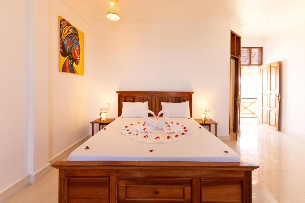 Postel nebo postele na pokoji v ubytování Diacarisma Boutique Resort Nungwi