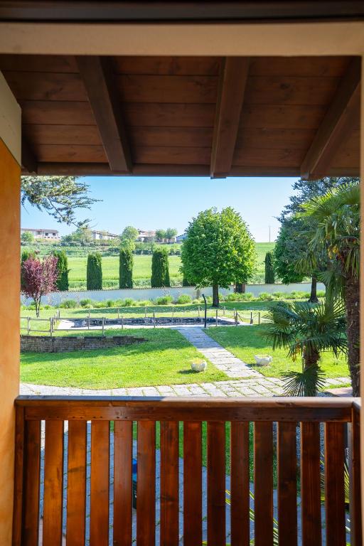 a balcony with a view of a park at Borgo Segreto del Garda in Monzambano