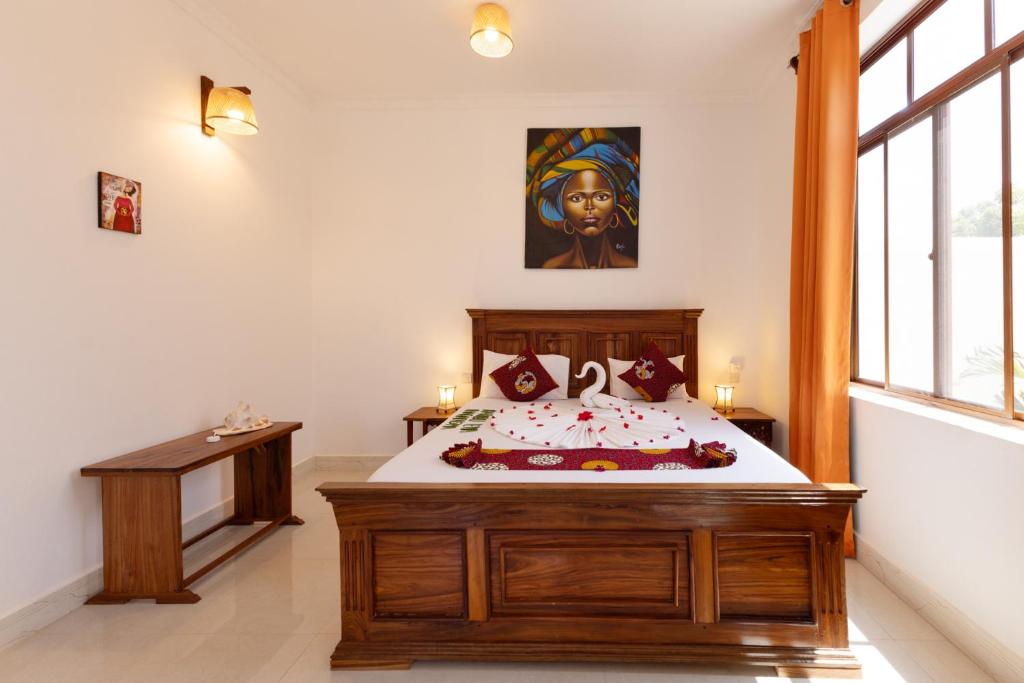 Postel nebo postele na pokoji v ubytování Diacarisma Boutique Resort Nungwi