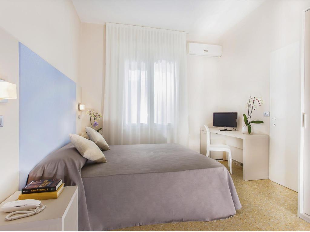 Postel nebo postele na pokoji v ubytování New Hotel Chiari