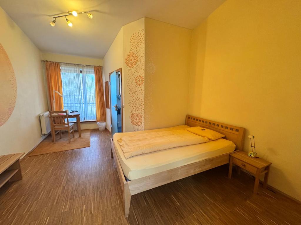 Postel nebo postele na pokoji v ubytování Hotel Grünwald