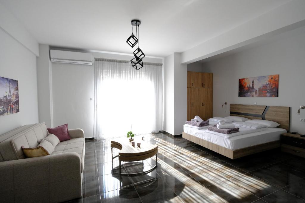 a living room with two beds and a couch at Eva House 1 in Drama
