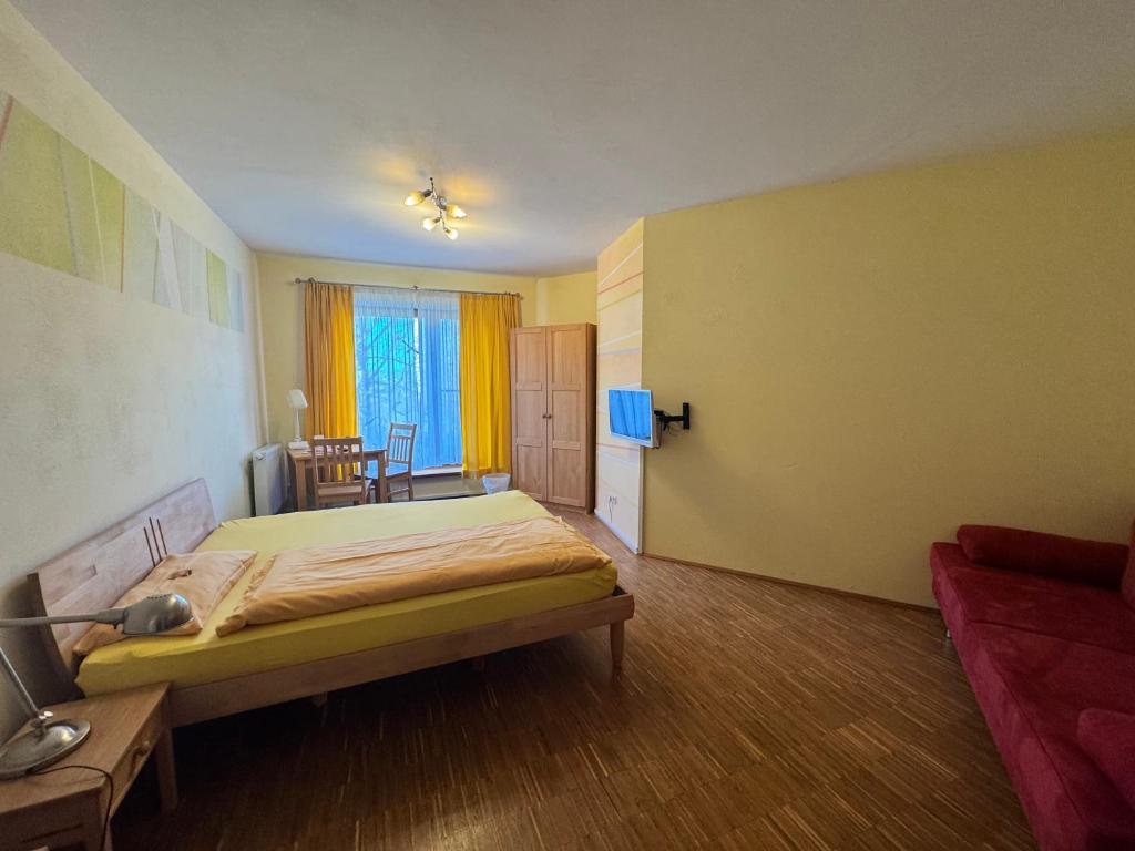 Postel nebo postele na pokoji v ubytování Hotel Grünwald