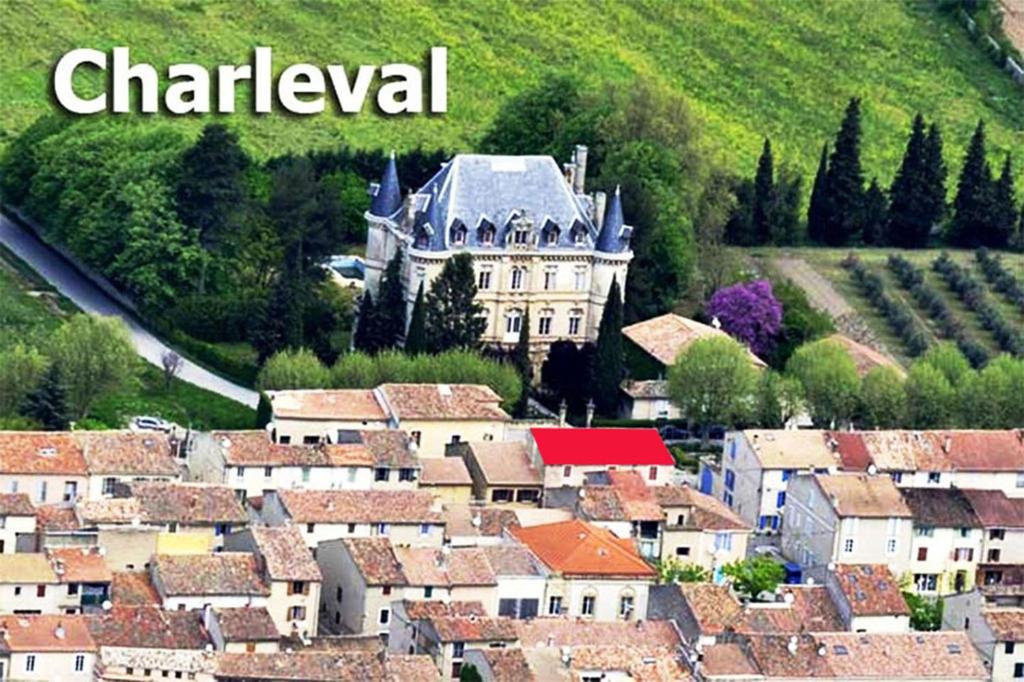 an aerial view of a town with a castle at GitesLuberon 5 in Charleval