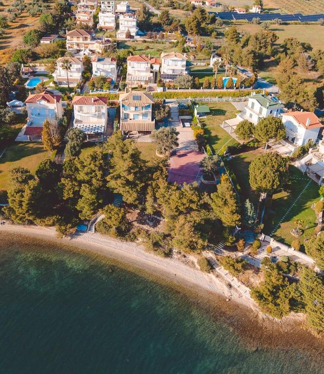 an aerial view of a house on a beach at Villa Sapphire BeachFront Eretria in Eretria