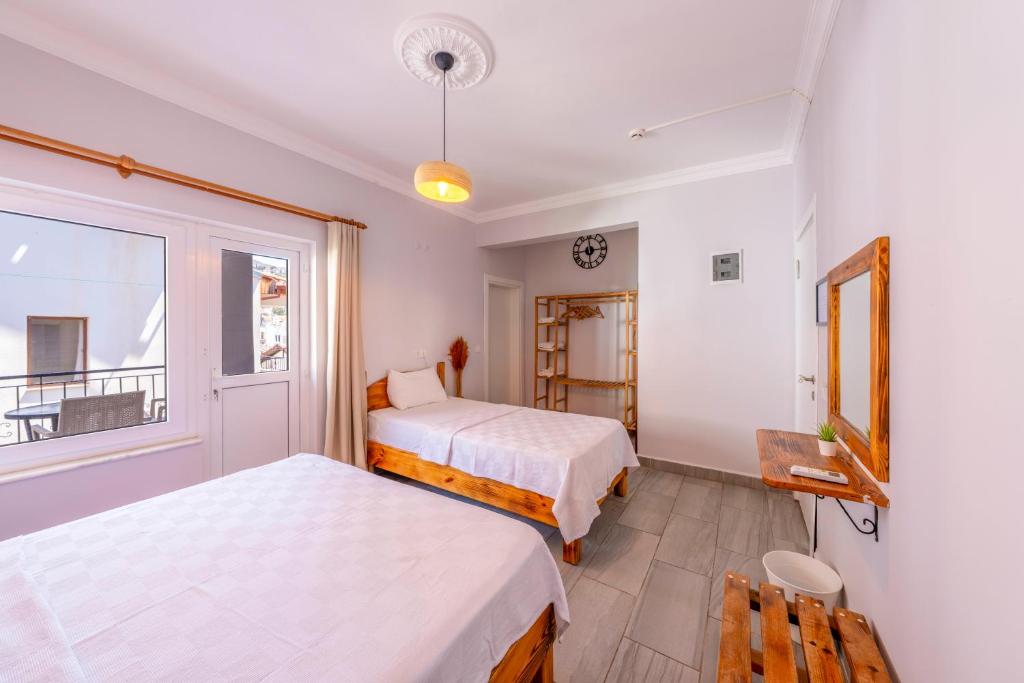 Postel nebo postele na pokoji v ubytování Larex Otel