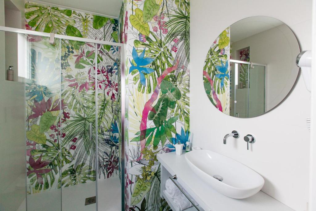 a bathroom with a sink and a mirror at Dimora Nesea in Cozze