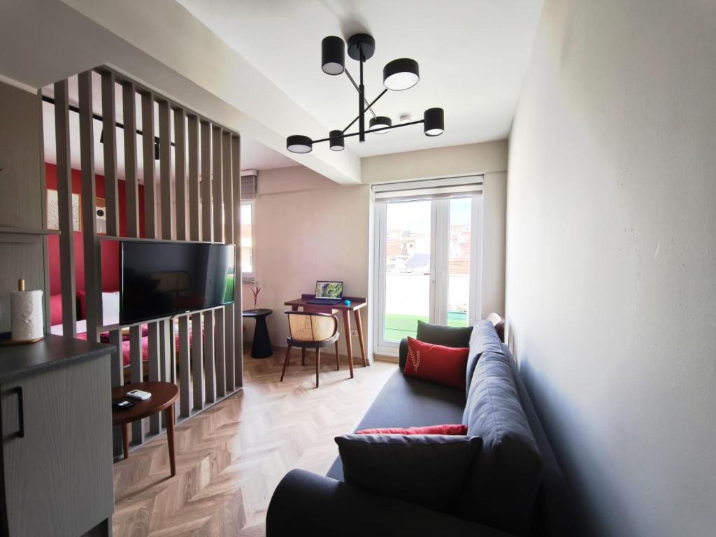 a living room with a couch and a television at La Casa Privada in Istanbul