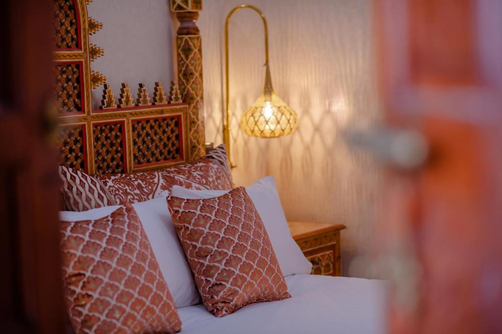 Postel nebo postele na pokoji v ubytování Riad El Wiam